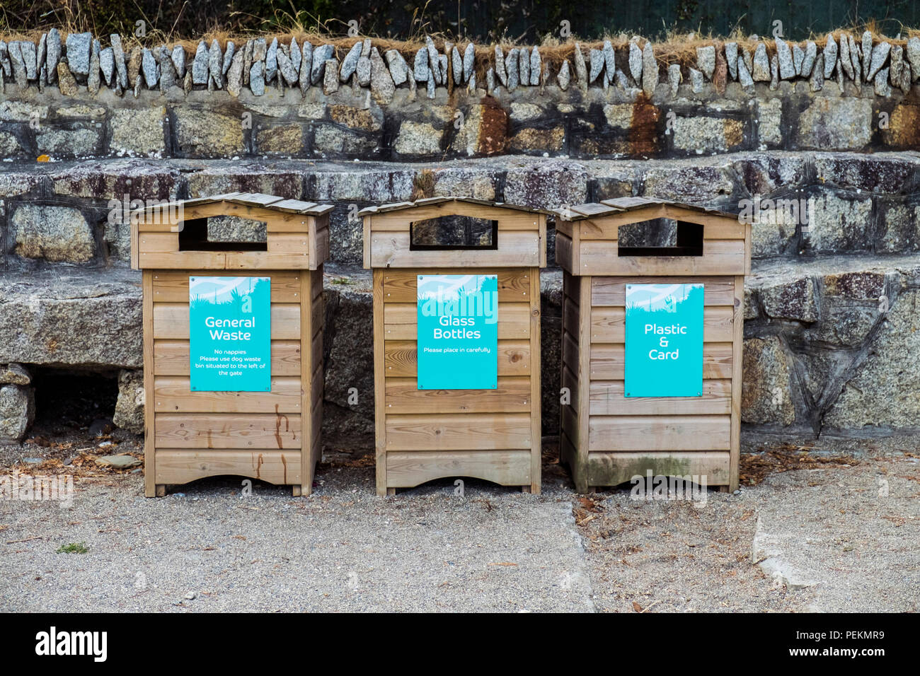 Wooden refuse bins labelled for recycling Green issues. Stock Photo