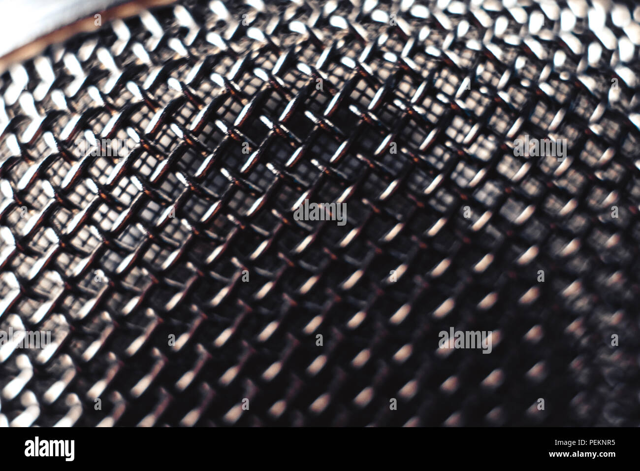 metal microphone Grille, black background macro photography Stock Photo