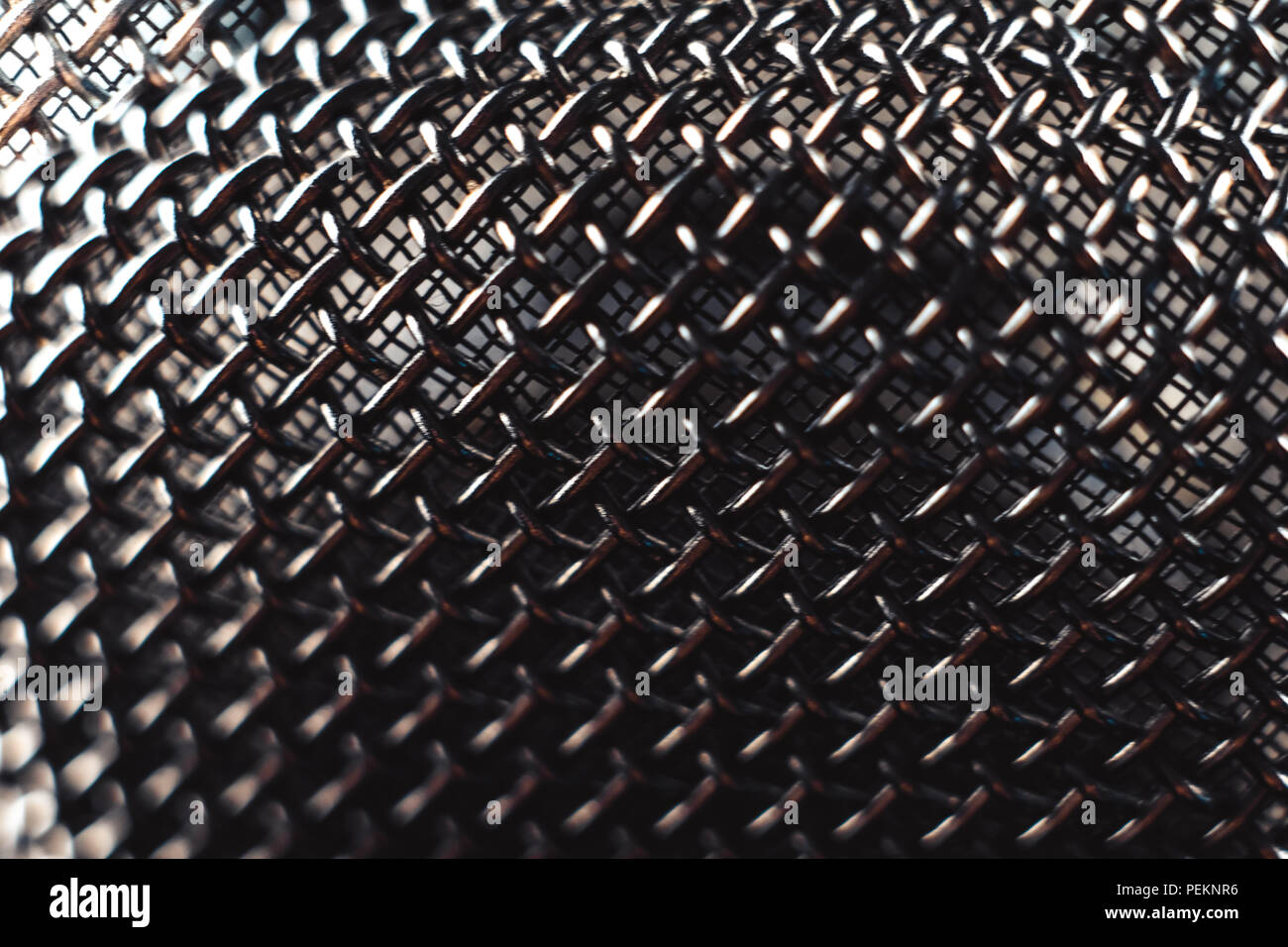 metal microphone Grille, black background macro photography Stock Photo