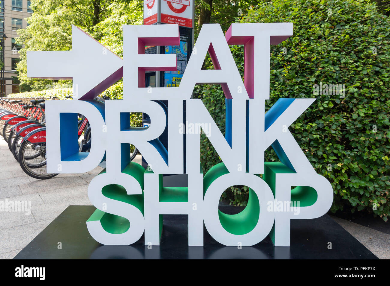 Eat, drink, shop sign in Jubilee Park, Canary Wharf, London Borough of Tower Hamlets, London, Greater London, England, United Kingdom Stock Photo