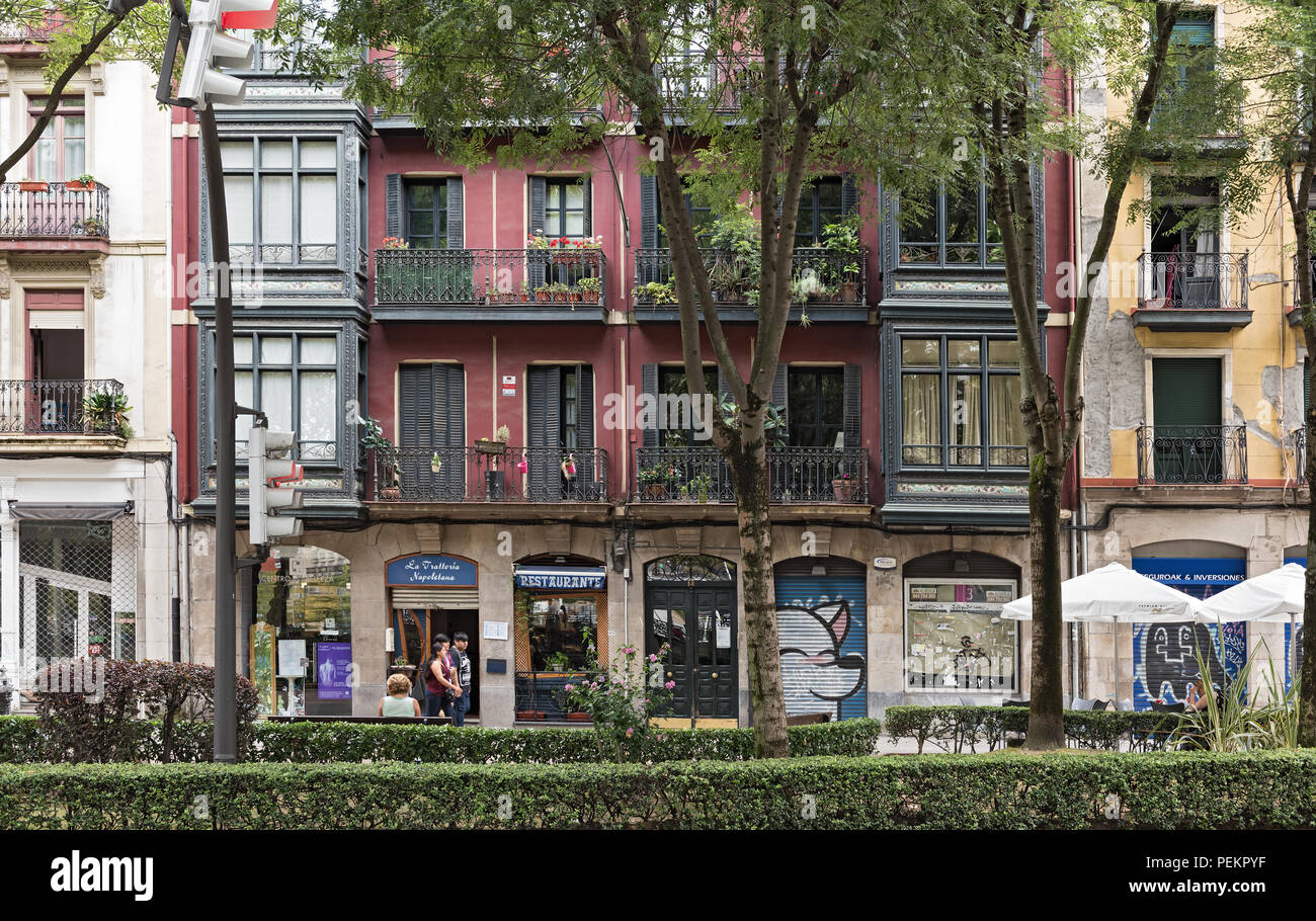 house front and small park in bilbao, spain. Stock Photo