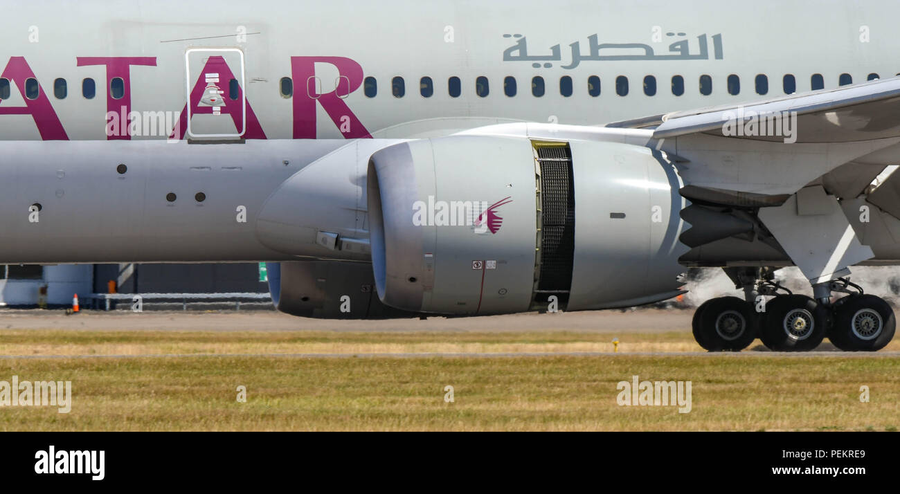 CARDIFF, WALES - JULY 2018: Close up view of the engine of a Qatar Airways Boeing 787 Dreamliner with thrust reverser flap open. Stock Photo