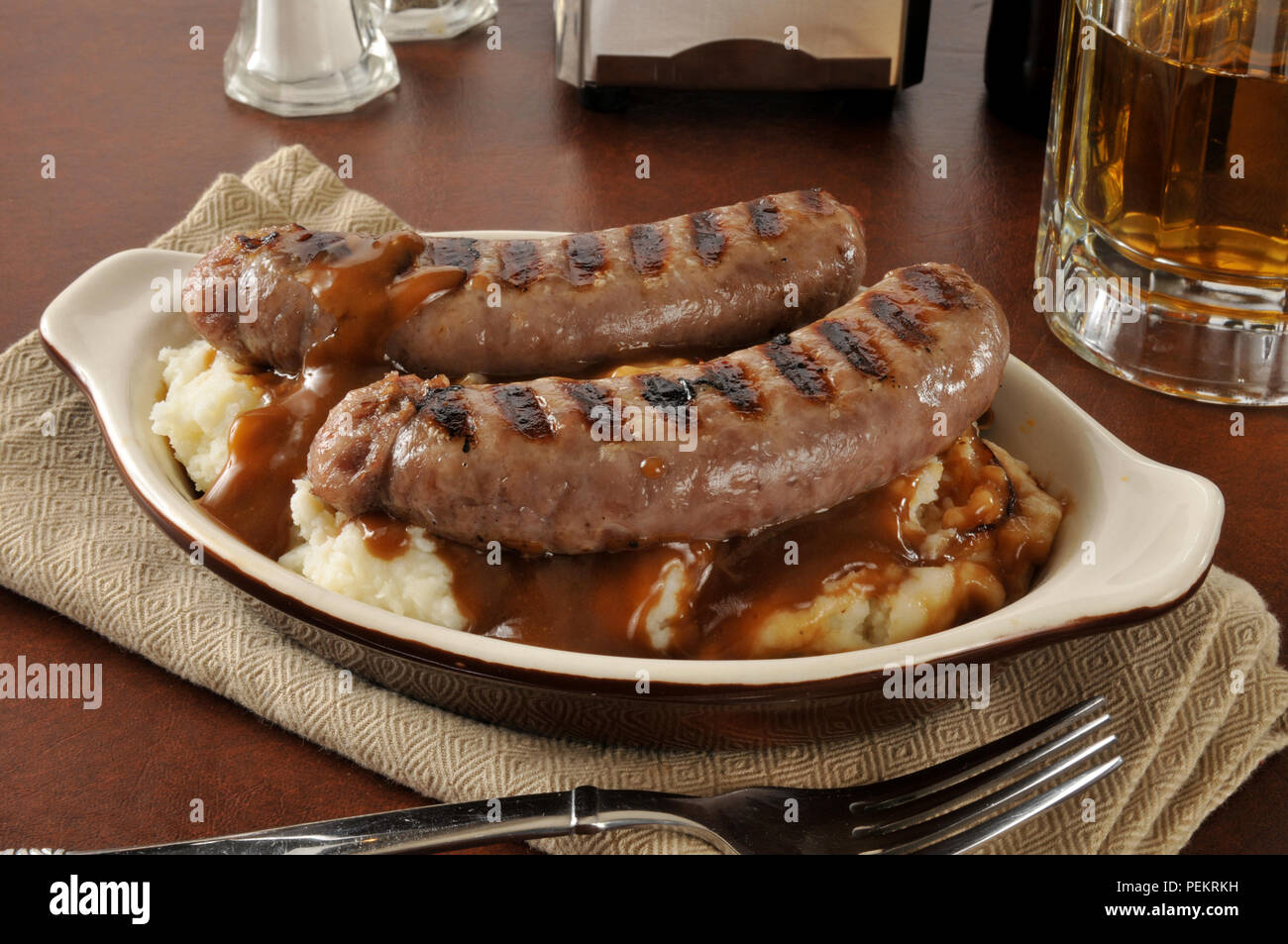 Bangers and mash with onion mushroom gravy Stock Photo Alamy