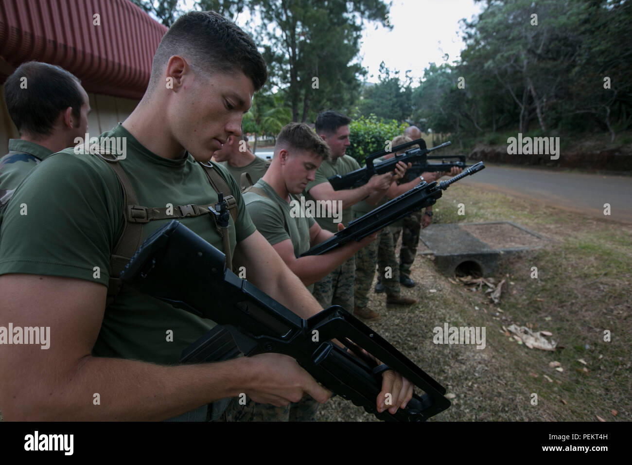 U.S. Marines with 1st Battalion, 2nd Marine Regiment, practice loading ...