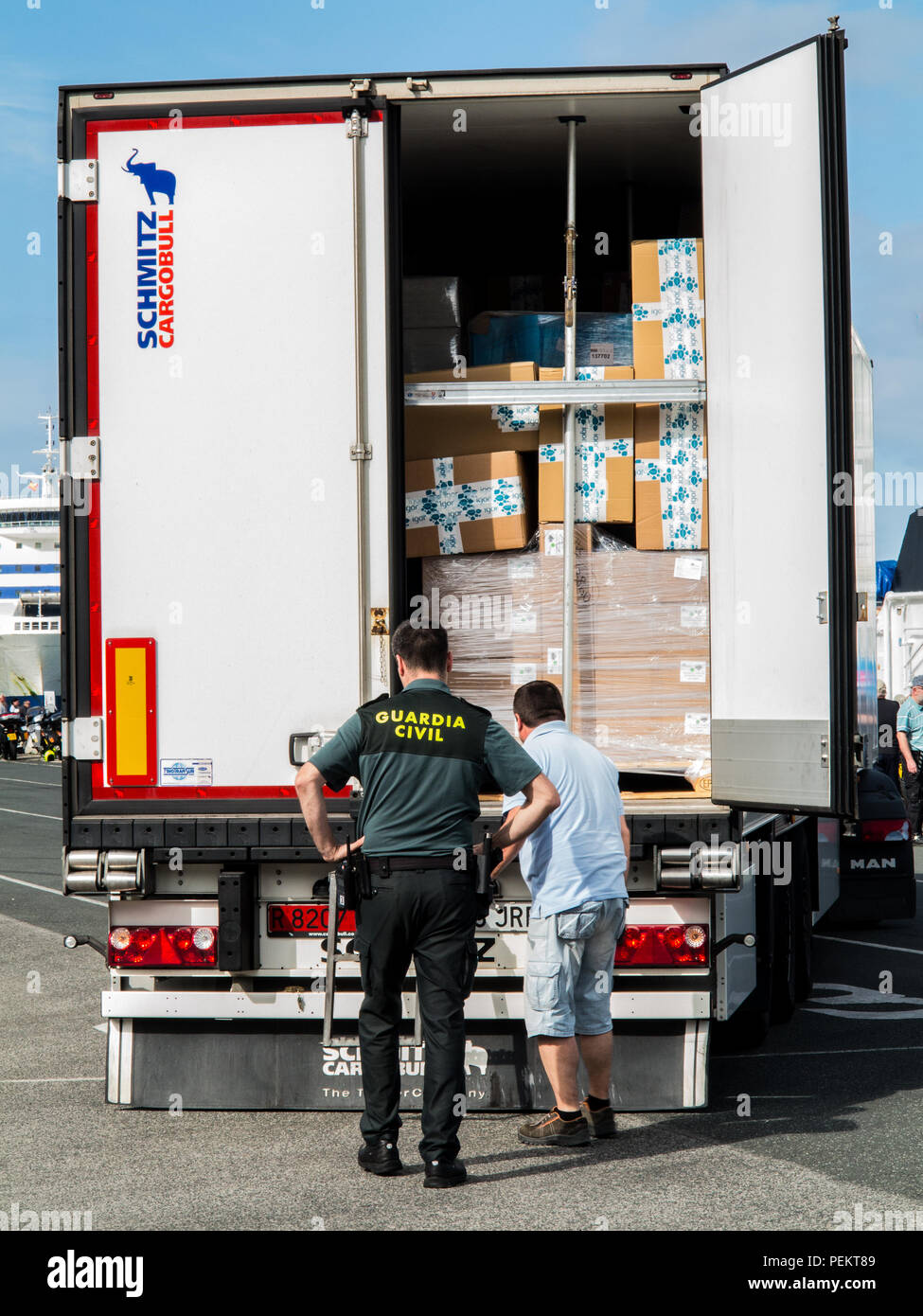 Spanish border guard  police Guardia Civil inspect search examine a container wagon lorry vehicle at the ferry port docks of Santander Spain Stock Photo