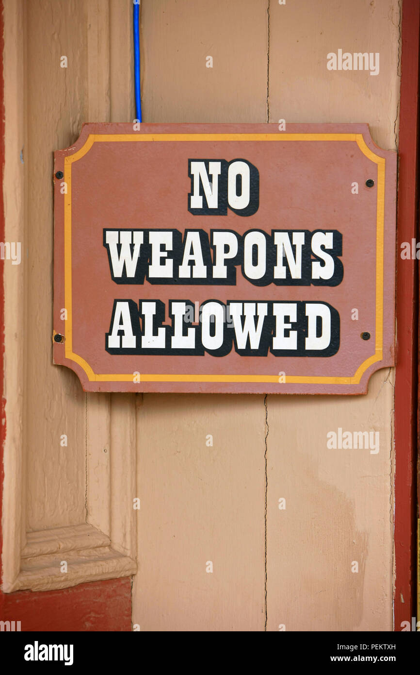 No Weapons Allowed sign outside a saloon in Tombstone, Arizona Stock Photo