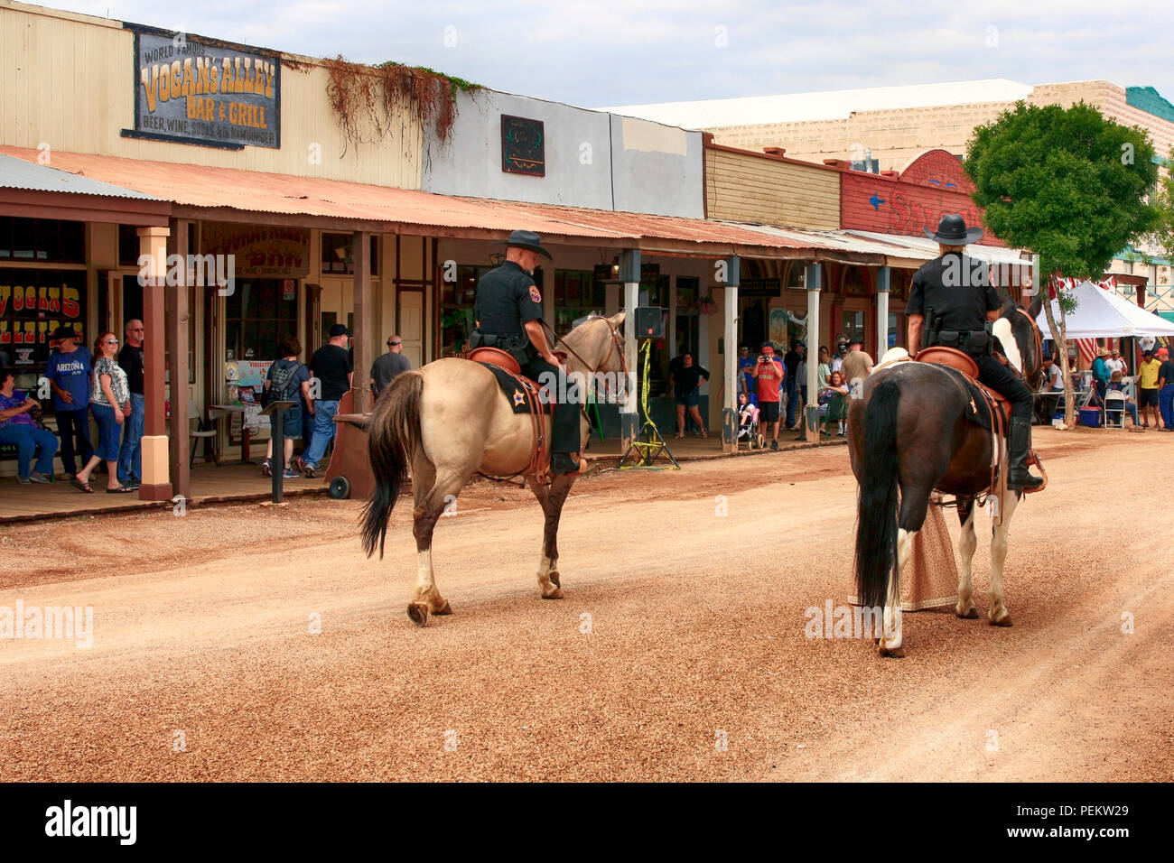 Two Arizona Rangers on horseback ride along E Allen St at the annual Doc Holiday event in