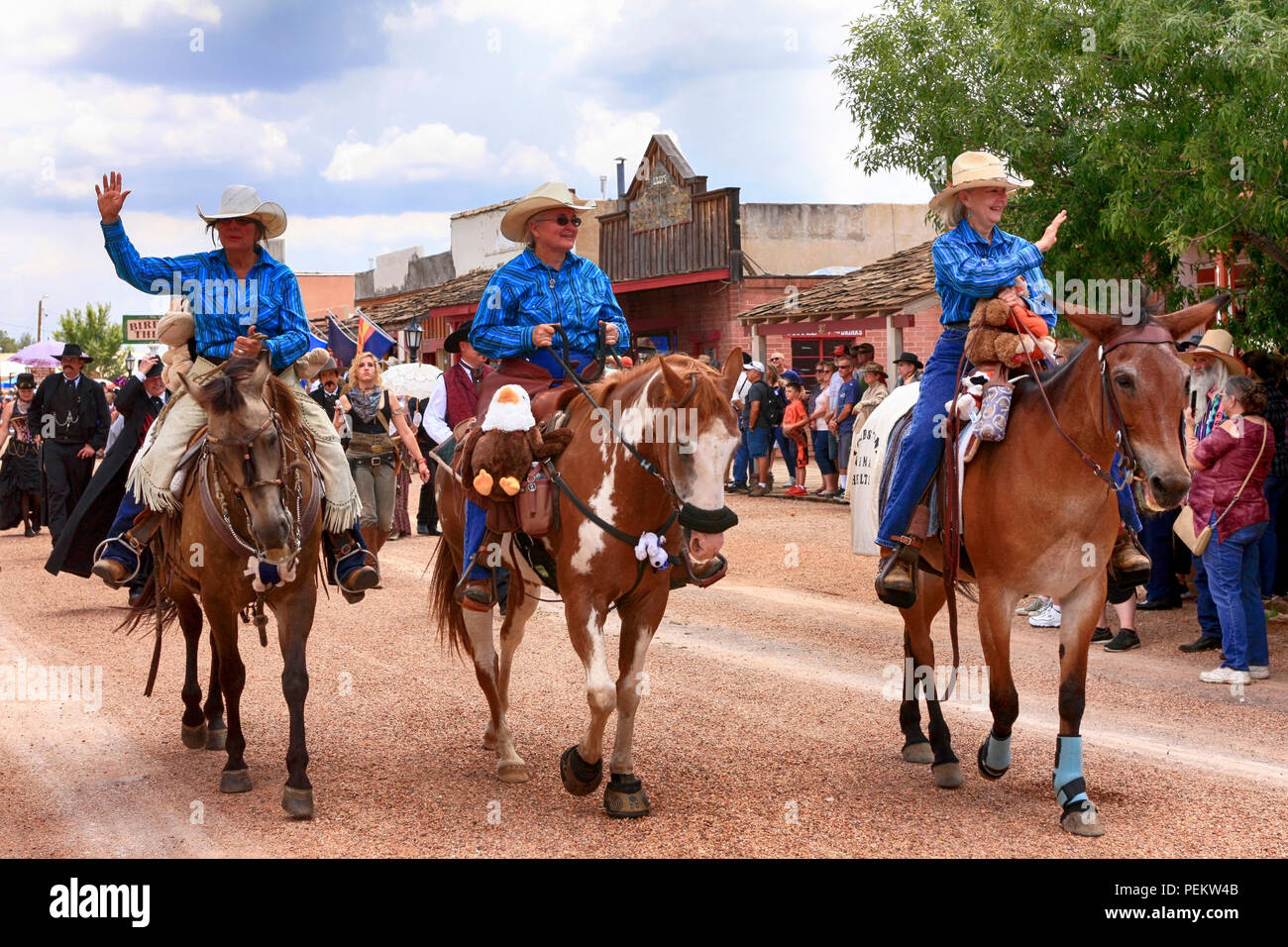 Riders on horses from the Tombstone Animal Shelter take part in the