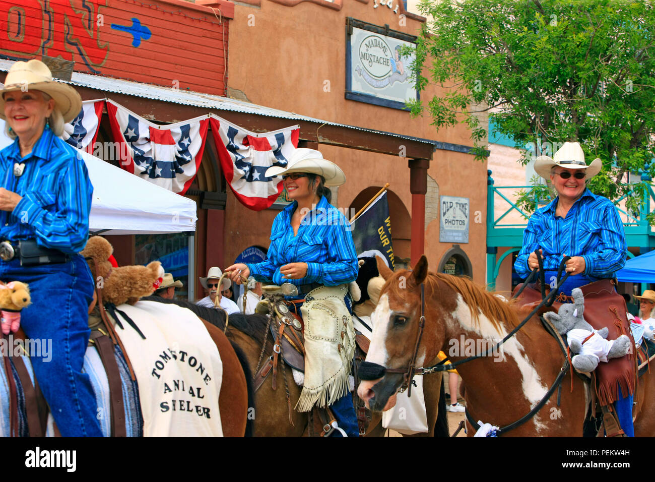 Riders on horses from the Tombstone Animal Shelter take part in the