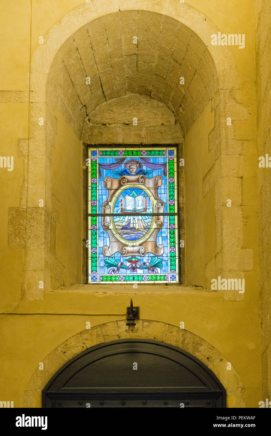 Italy Sicily Syracuse Siracusa Ortygia Baroque Duomo Templo di Minerva cathedral Saint Bishop Zosimo detail stained glass window book quote Genisis Stock Photo