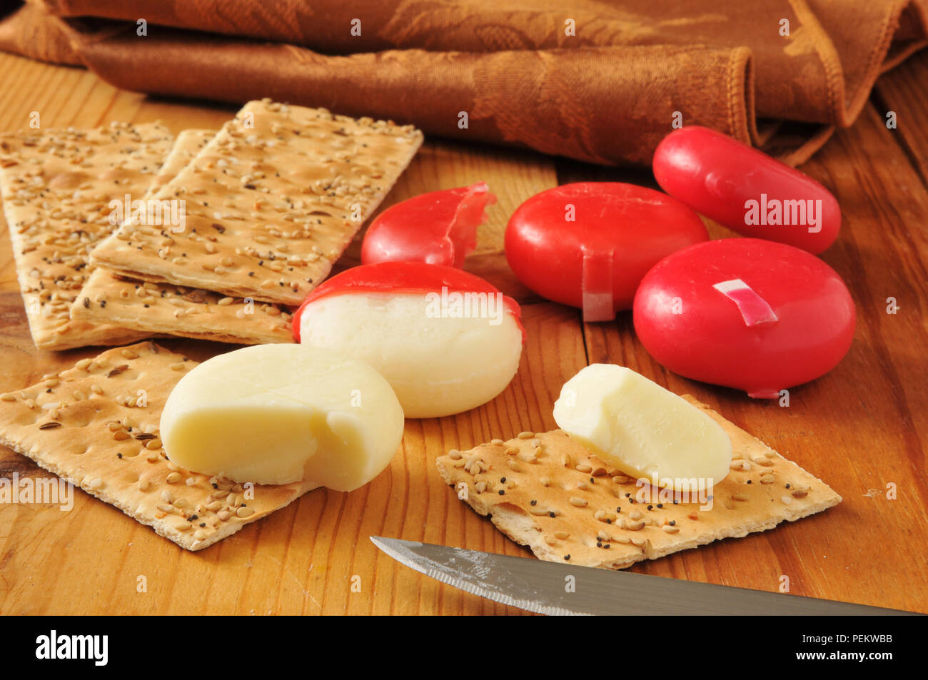 Sharp, white cheddar cheese with flatbread crackers Stock Photo