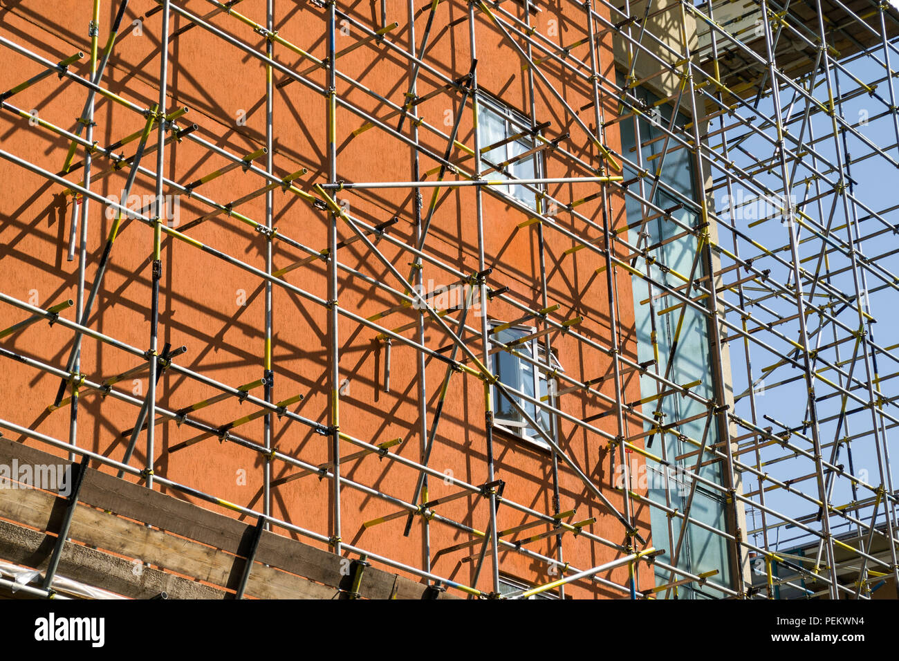 Exterior of a multi storey building with scaffolding built around it, London, UK Stock Photo