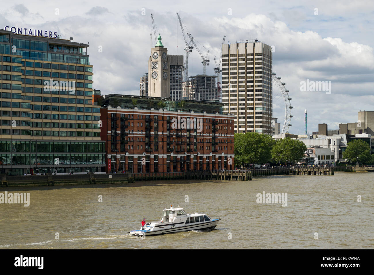 OXO tower wharf and adjacent buildings on a sunny Summer morning with boat on river Thames, London, UK Stock Photo