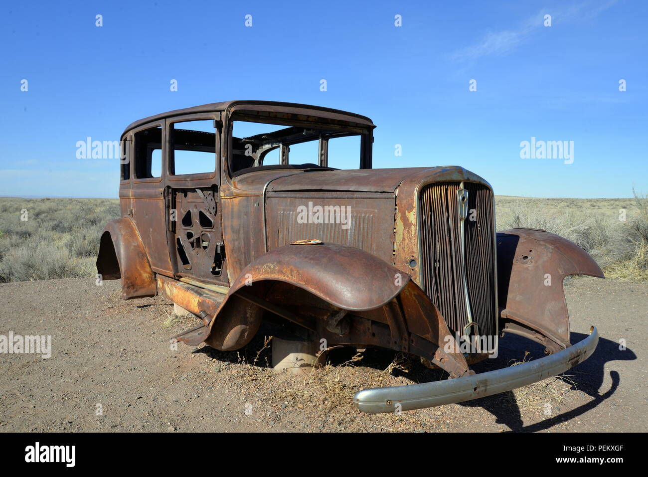Rusted old 1932 Studebaker at old Route 66 in Petrified Forest National Park Stock Photo
