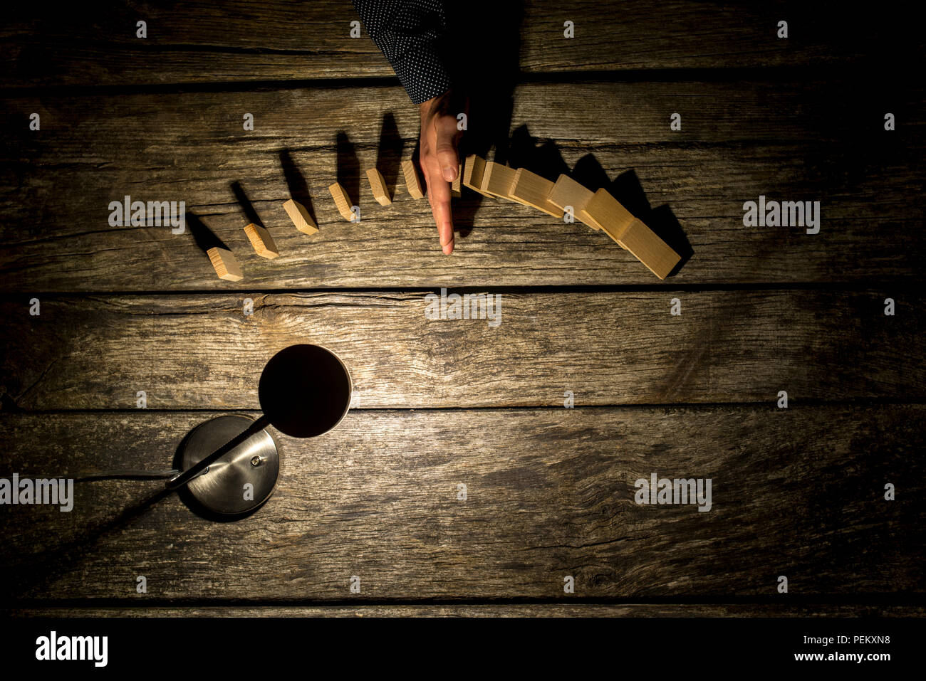 Overhead view of a rustic wooden desk illuminated with a lamp with a