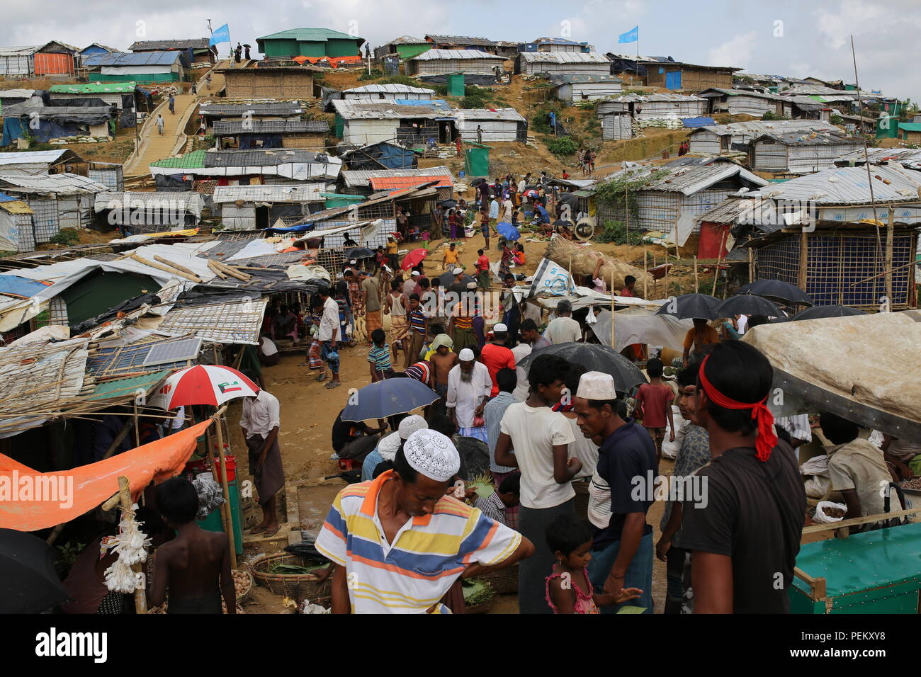 Cox’s Bazar, Bangladesh. Rohingya refugee market seen at a refugee camp in Ukhia, Cox’s Bazar, Bangladesh on August 3, 2018. Monsoon rain causing flooding landslides in the world largest refugee camp in Bangladesh, where more than one million Rohingya people are living in bamboo and and tarpaulin sheet shelters. Over half a million Rohingya refugees from Myanmar’s Rakhine state, have fled into Bangladesh since August 25, 2017 according to UN. The Myanmar military's latest campaign against the Rohingyas began after the attack on multiple police posts in Rakhine state. Stock Photo