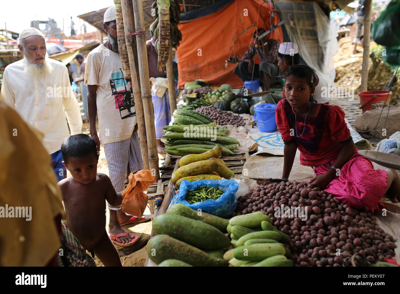 Cox’s Bazar, Bangladesh. Rohingya refugee market seen at a refugee camp in Ukhia, Cox’s Bazar, Bangladesh on August 3, 2018. Monsoon rain causing flooding landslides in the world largest refugee camp in Bangladesh, where more than one million Rohingya people are living in bamboo and and tarpaulin sheet shelters. Over half a million Rohingya refugees from Myanmar’s Rakhine state, have fled into Bangladesh since August 25, 2017 according to UN. The Myanmar military's latest campaign against the Rohingyas began after the attack on multiple police posts in Rakhine state. Stock Photo