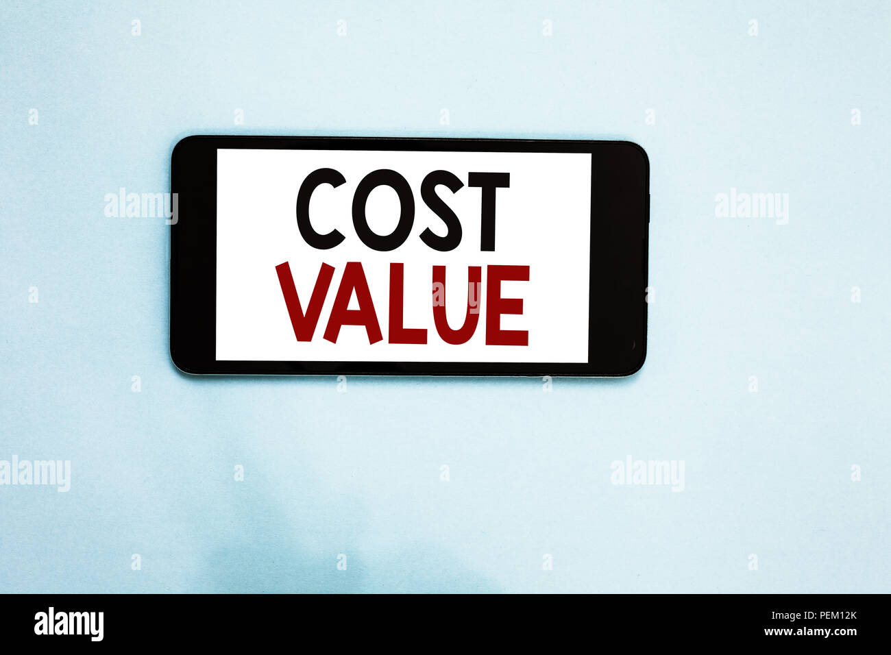 Text sign showing Cost Value. Conceptual photo The amount that usualy paid for a item you buy or hiring a person Cell phone white screen over light bl Stock Photo