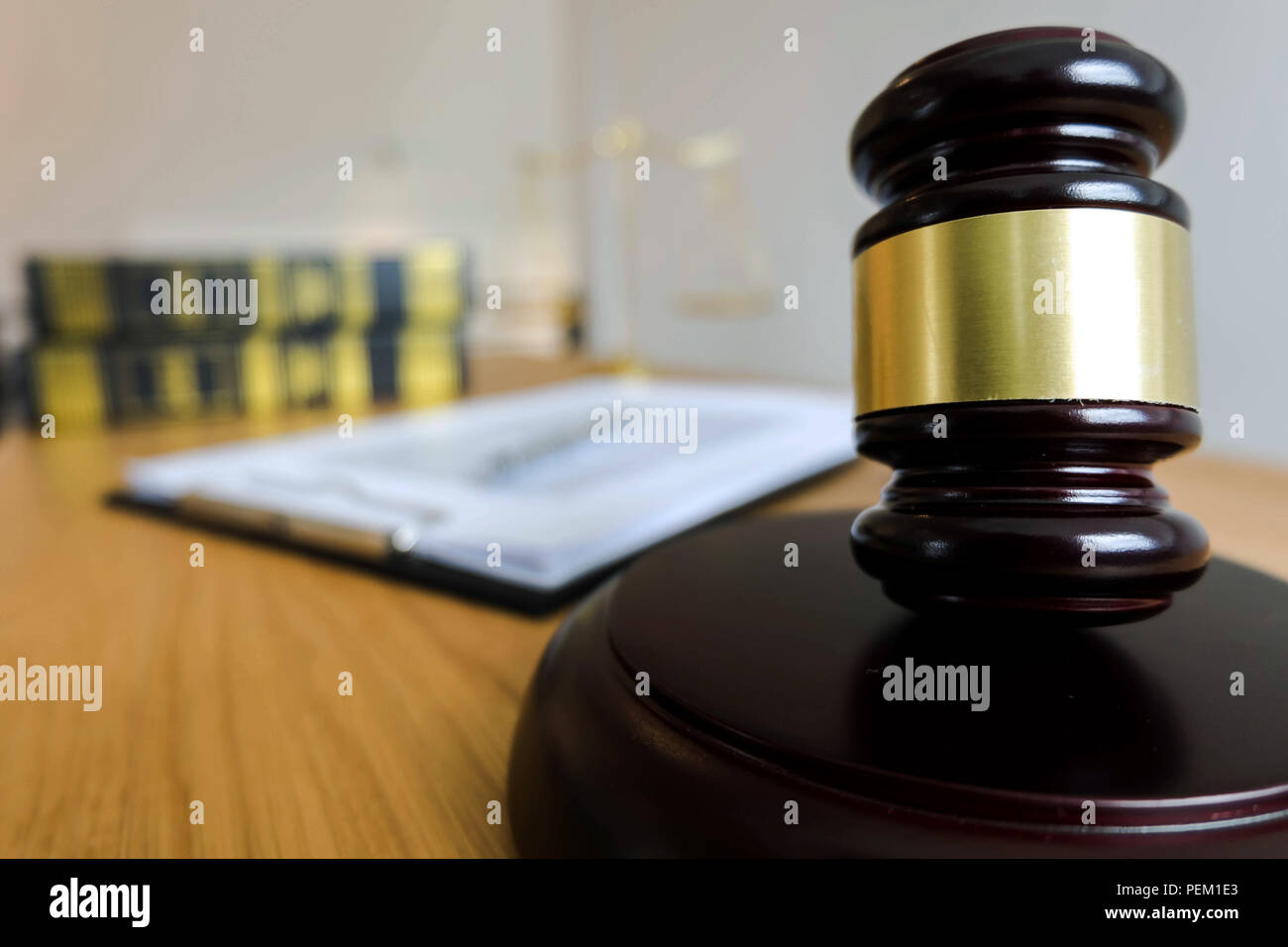 Close up object  law concept. Judge gavel with justice lawyers and documents working on table. Stock Photo