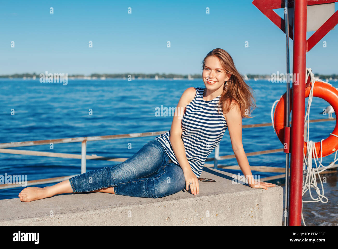 Girl wearing blue jeans and white shirt hi-res stock photography and images  - Page 3 - Alamy