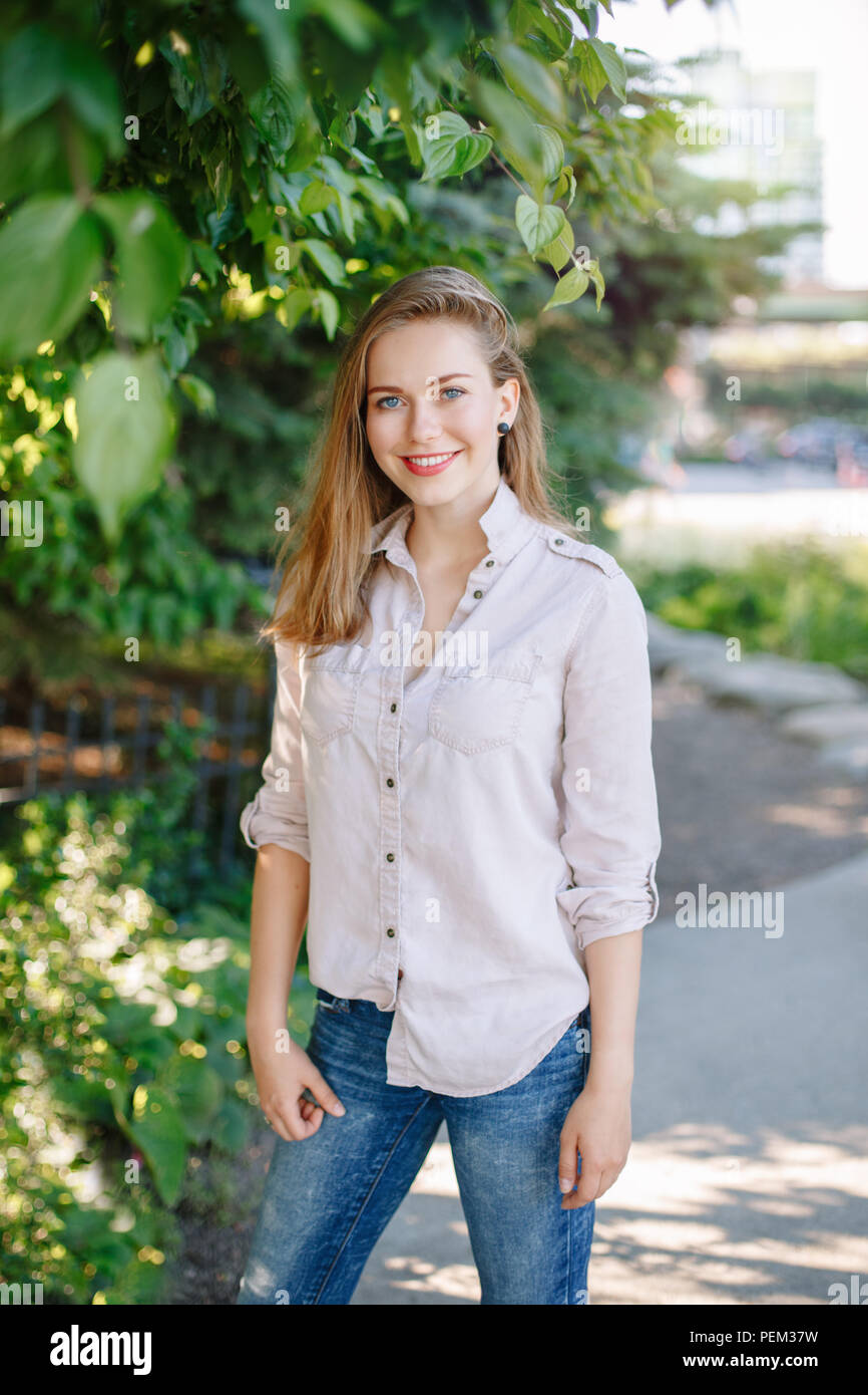 Portrait Of Beautiful Smiling White Caucasian Girl Woman With Long Blonde Hair And Blue Eyes Wearing White Shirt And Jeans Outside In Summer Park A Stock Photo Alamy Portrait Of Beautiful Smiling White Caucasian Girl Woman With Long Blonde Hair And Blue Eyes Wearing White Shirt And Jeans Outside In Summer Park A Stock Photo Alamy