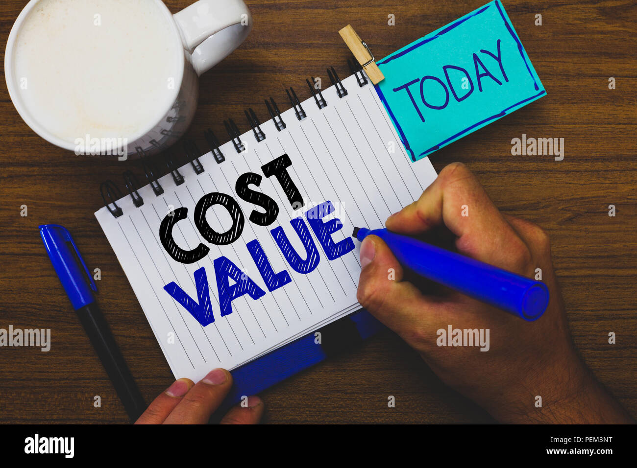 Word writing text Cost Value. Business concept for The amount that usualy paid for a item you buy or hiring a person Man holding marker notebook cloth Stock Photo