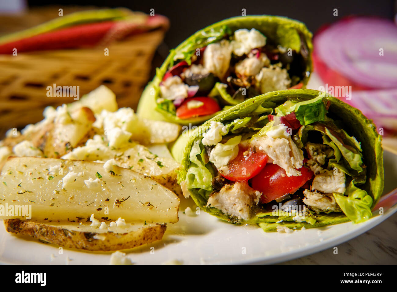 Healthy Greek chicken wrap with herbed potatoes and feta cheese Stock