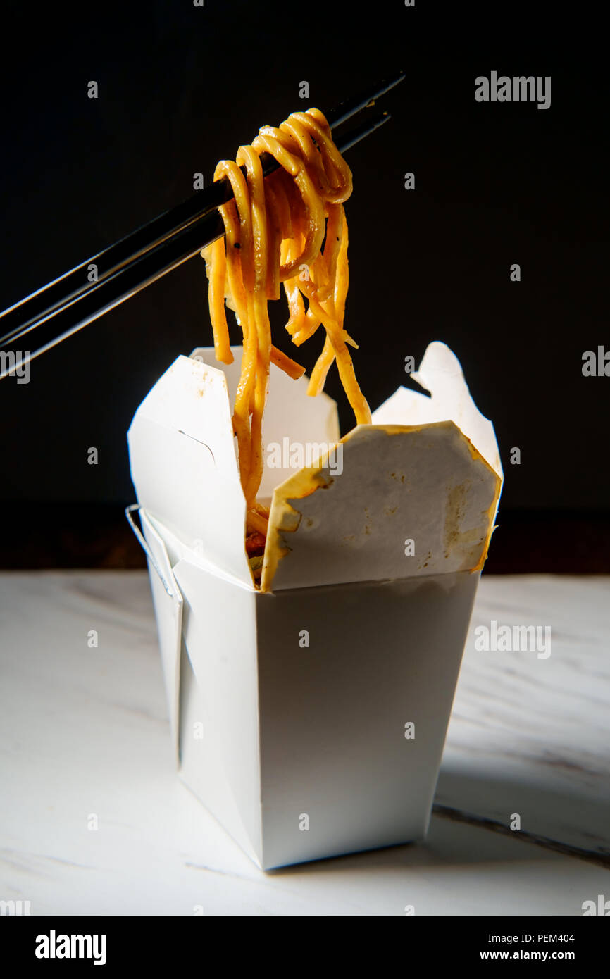 Eating Chinese pork lo mein noodles with chopsticks Stock Photo