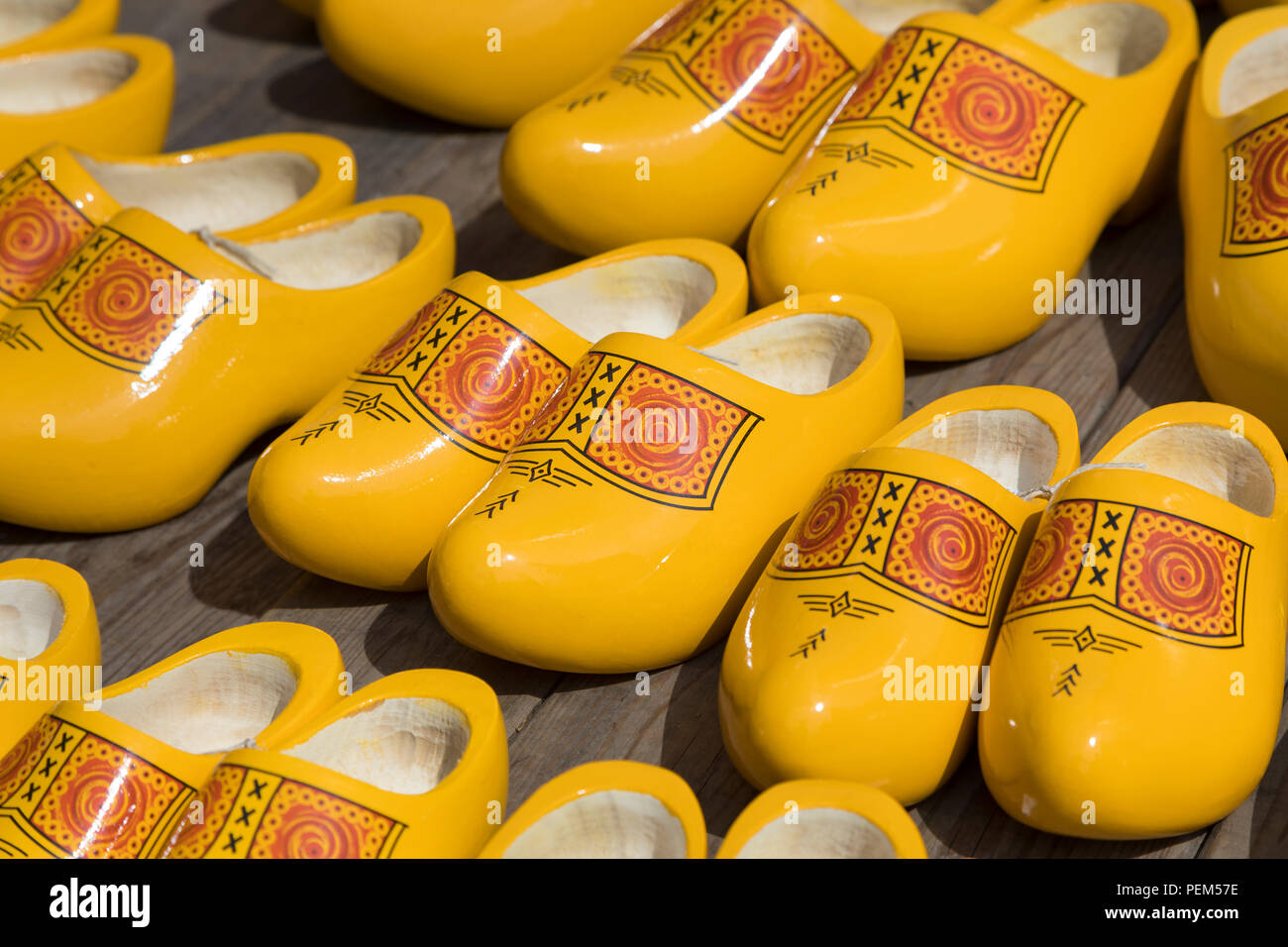 Pairs of yellow Dutch wooden shoes in a shop for sale Stock Photo