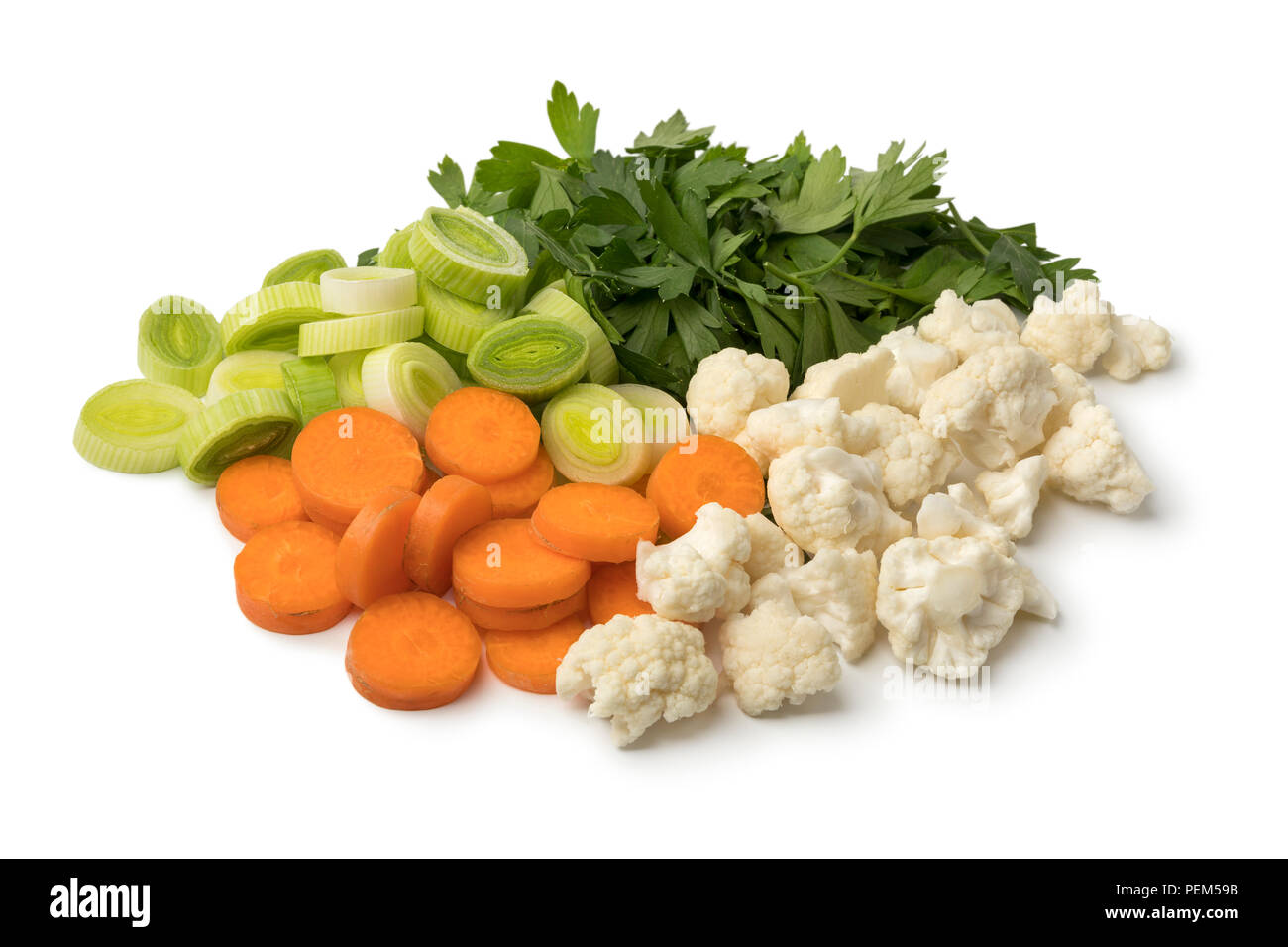 Heap of fresh cut organic vegetables isolated on white background