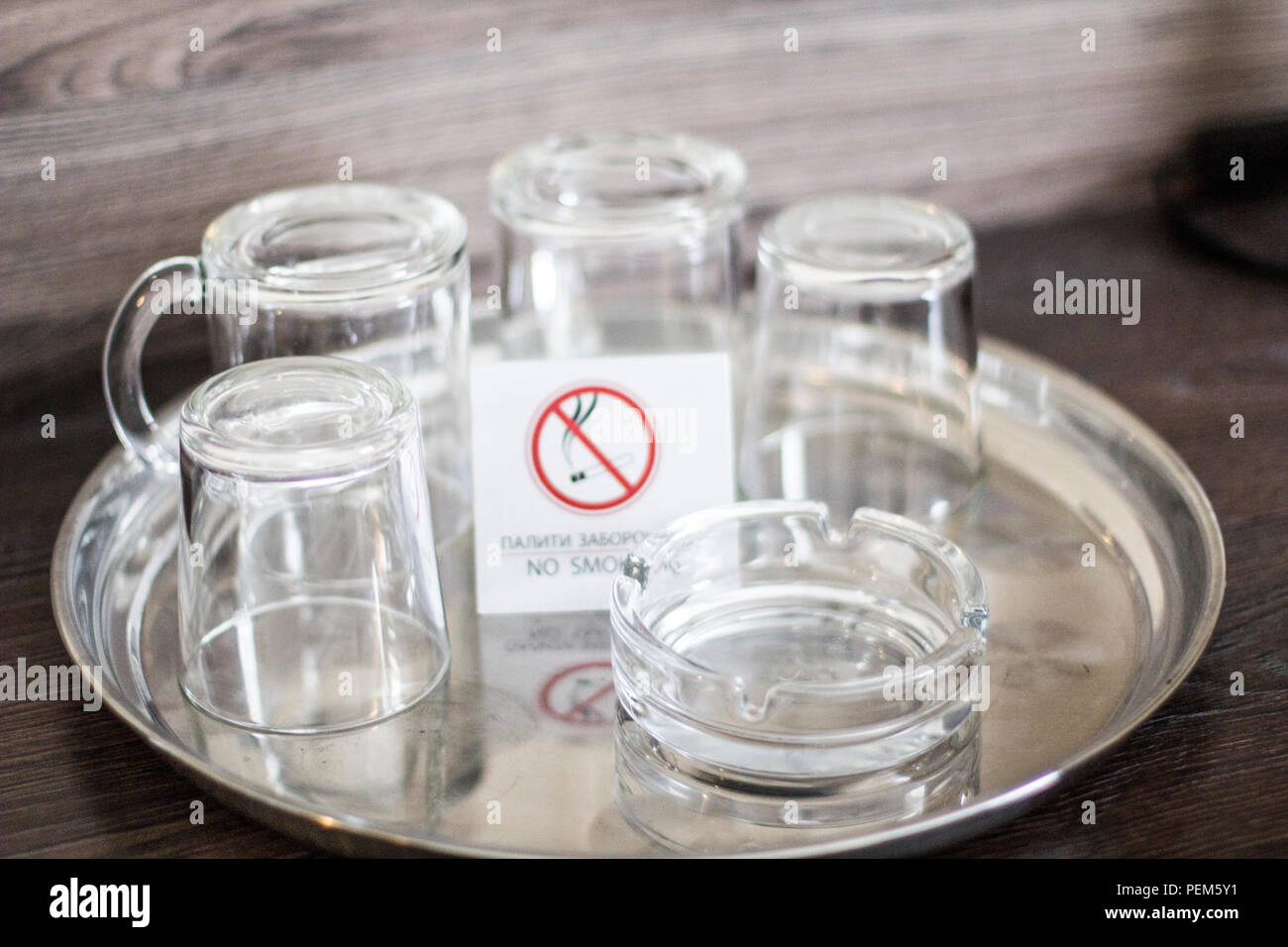 Glass cups with a plate No smoking. Glasses in the Ukrainian hotel. No