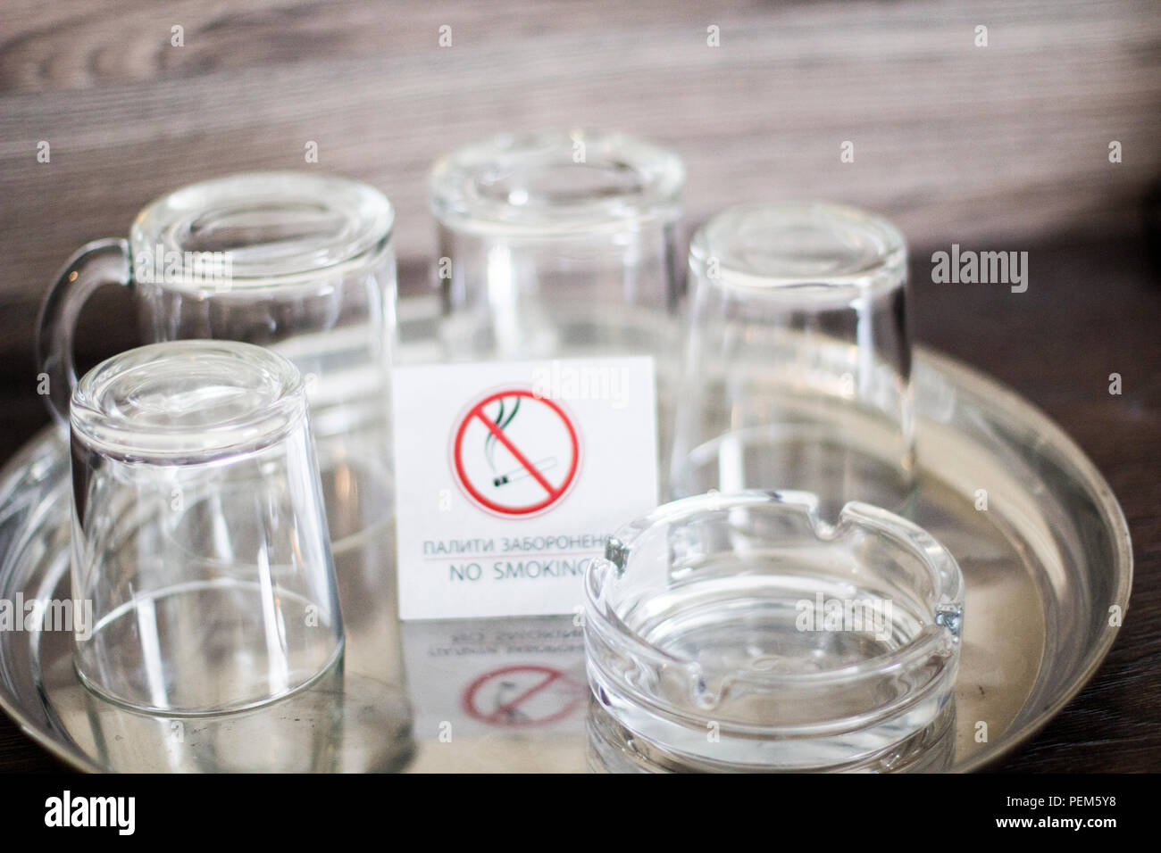Glass cups with a plate No smoking. Glasses in the Ukrainian hotel. No