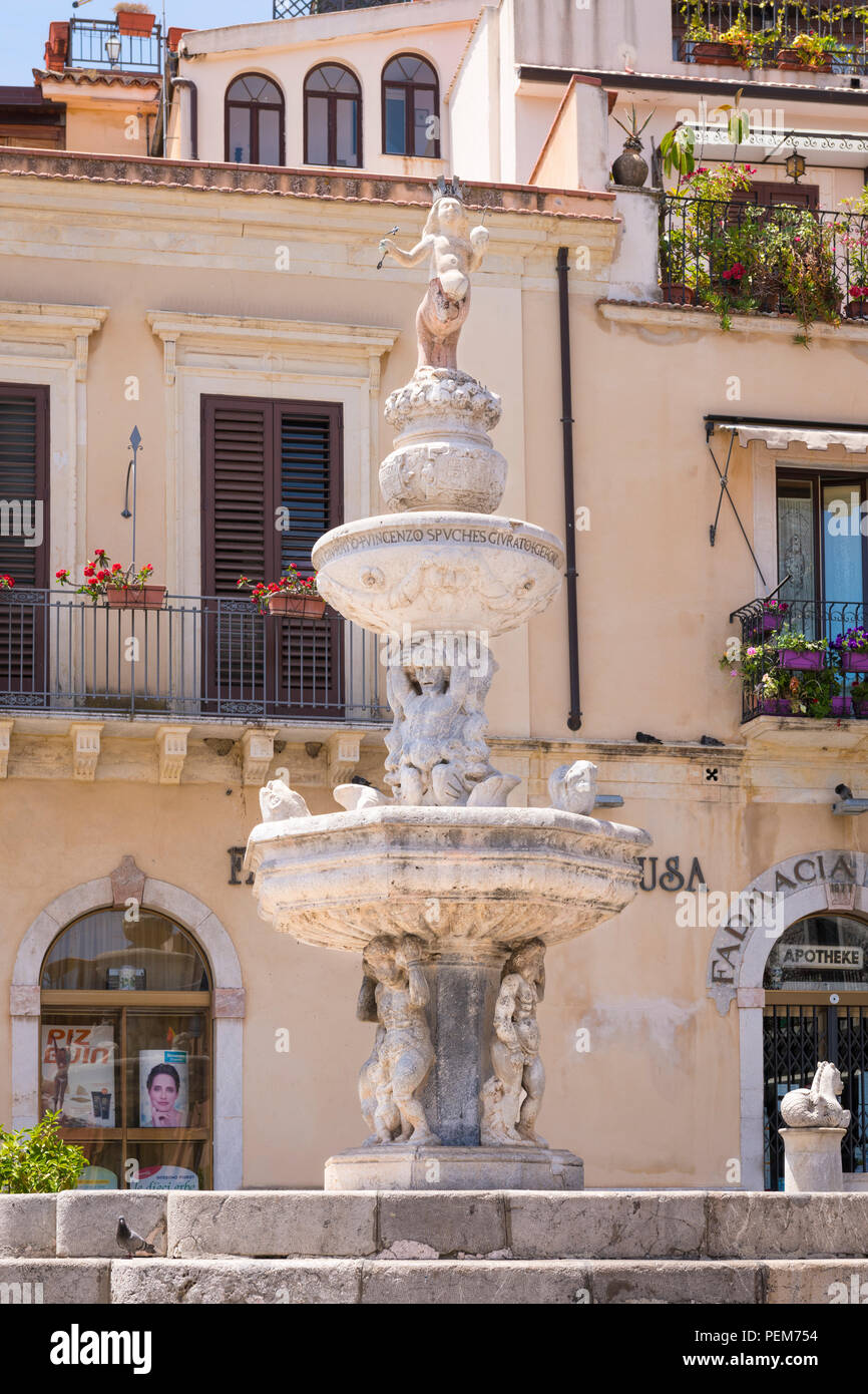 Italy Sicily Monte Tauro most famous luxury tourist resort Taormina Piazza del Duomo ornate Baroque fountain water feature cherubs angels balconies Stock Photo