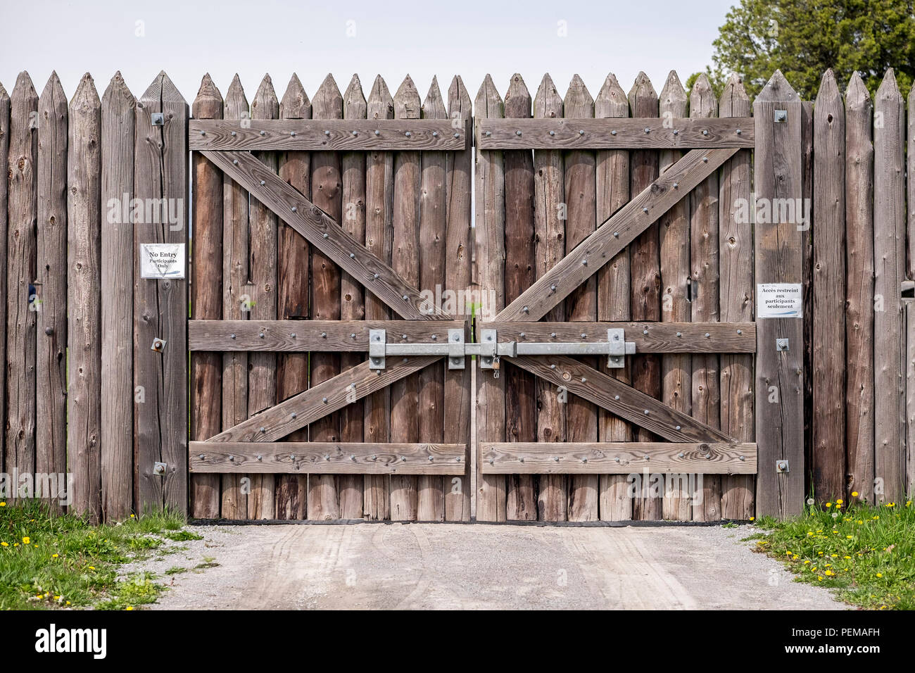 A wooden gate with spiked tops is securely barred at Fort George in Niagara on the Lake Ontario Canada. Stock Photo