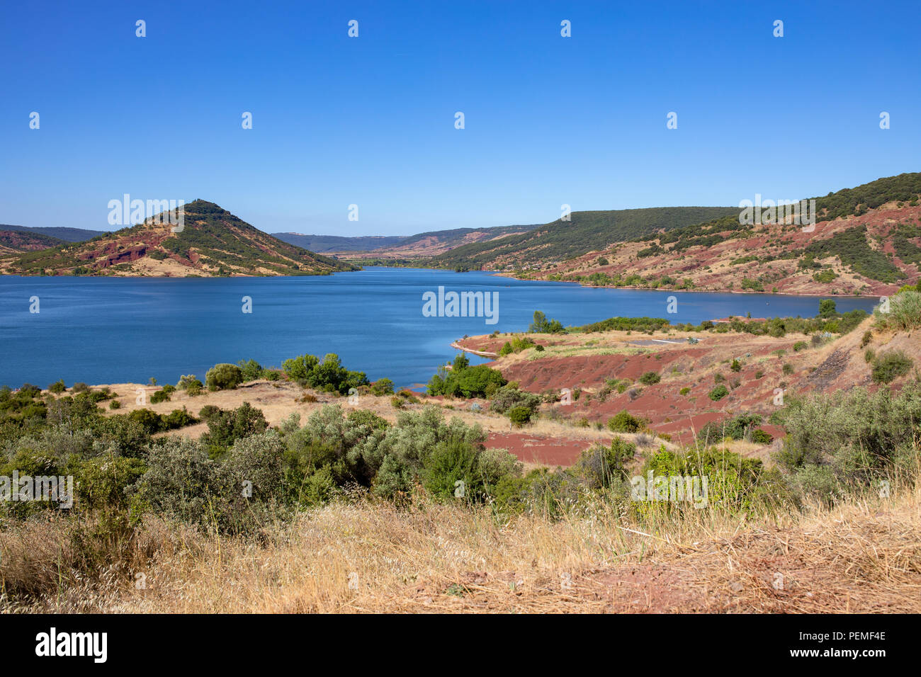 Lake Salagou (Lac du Salagou) France. Wide panorama, calm water and  colorful hills Stock Photo - Alamy