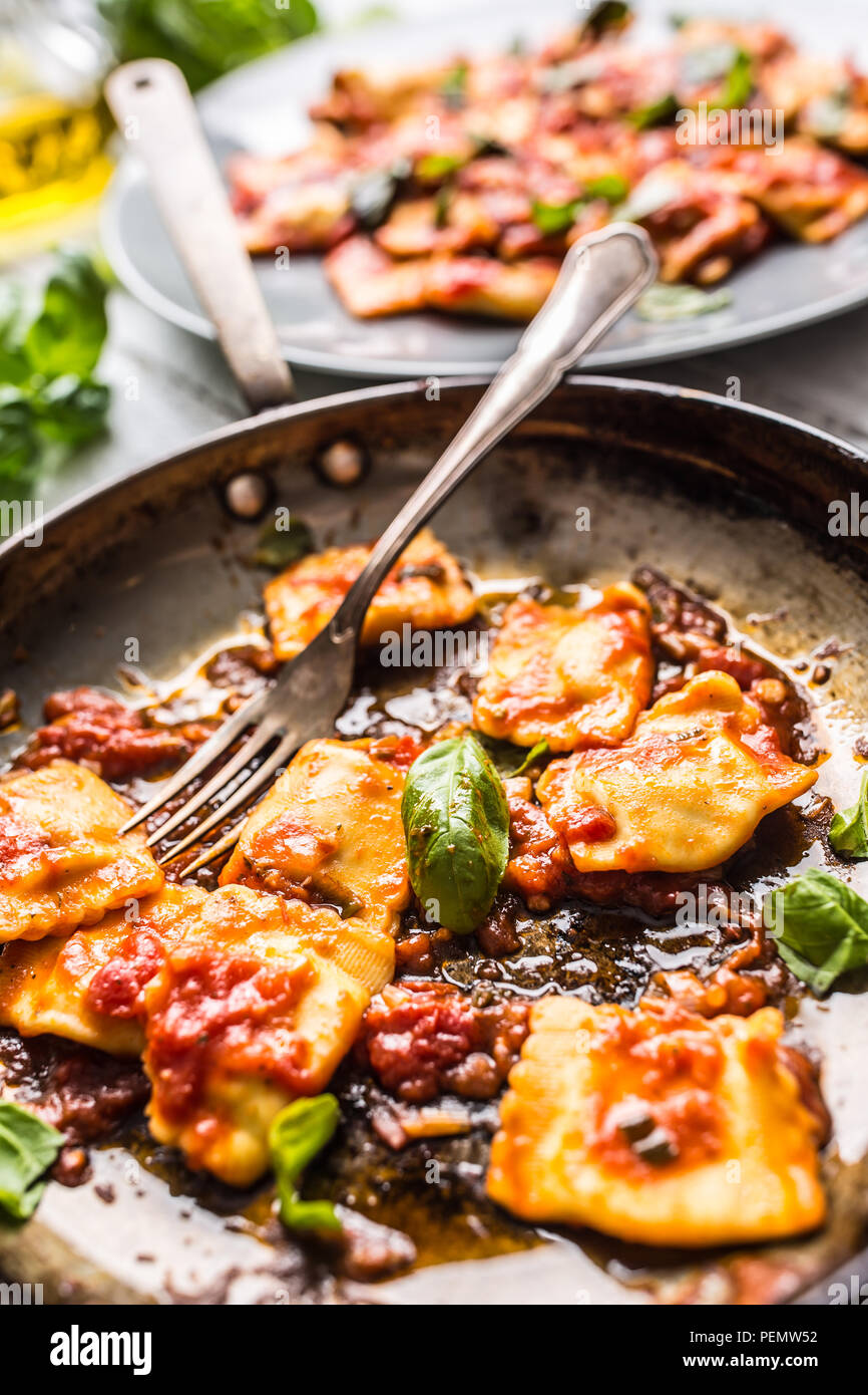 Italian or mediterranean food pasta ravioli of tomato sauce and basil. Stock Photo