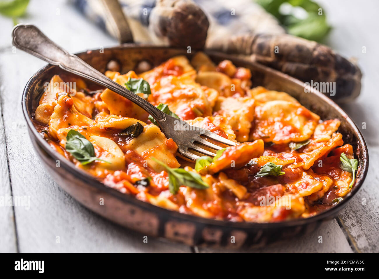 Italian or mediterranean food pasta ravioli of tomato sauce and basil. Stock Photo