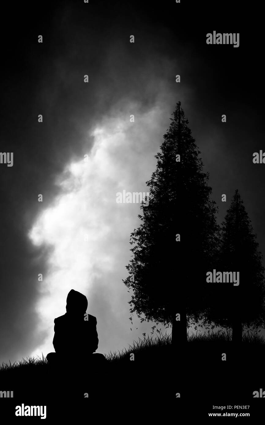 silhouette of someone sitting under the trees and looking at the dark clouds of a storm coming closer Stock Photo