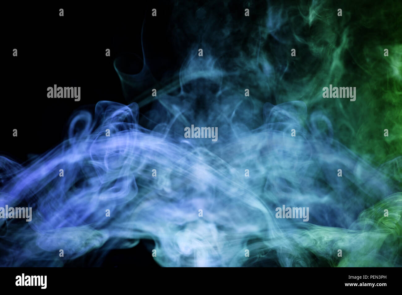 Cloud of blue and green smoke on a black isolated background ...