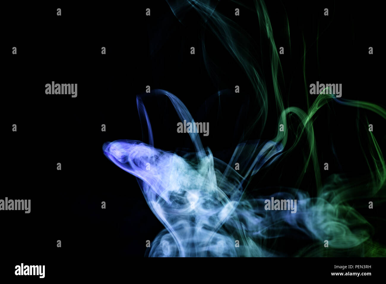 Blue anf green cloud smoke on black isolated background Stock Photo - Alamy