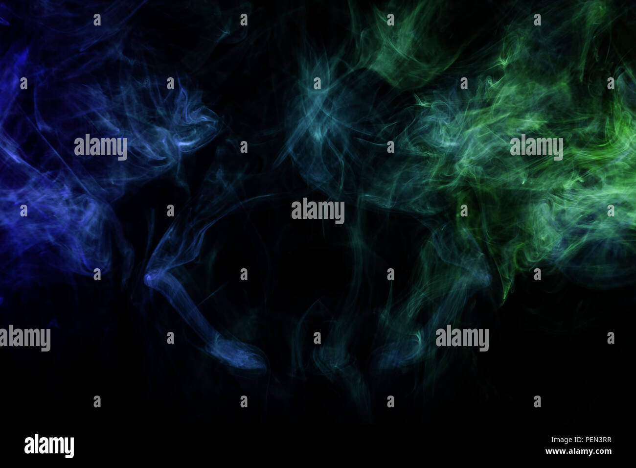 Blue anf green cloud smoke on black isolated background Stock Photo - Alamy