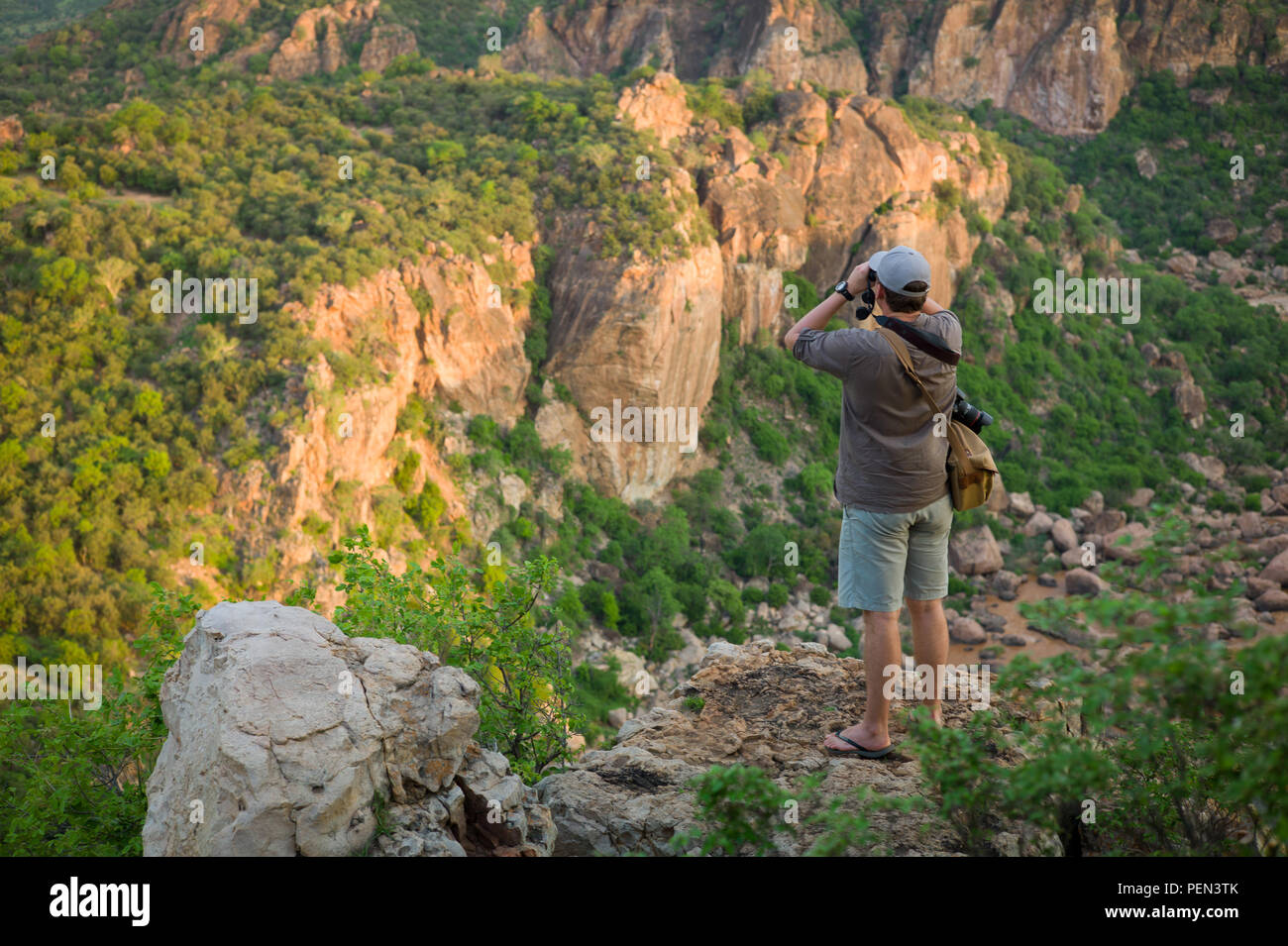 Young traveller looking over Lanner Gorge, carved by the Luvuvhu River, in the Pafuri region in the far north of Kruger National Park, South Africa. Stock Photo