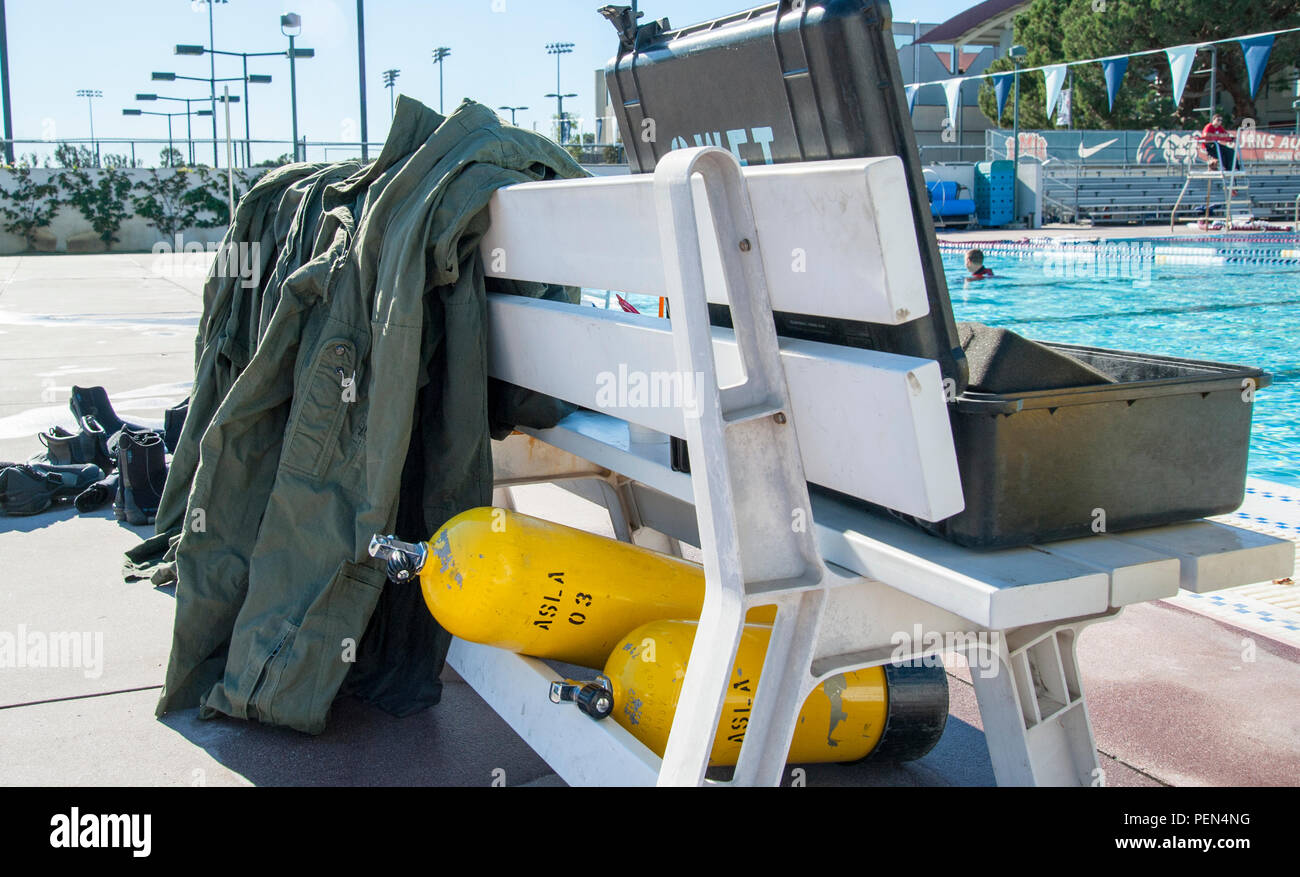 Crew members of Coast Guard Air Station Los Angeles conducted emergency aircraft evacuation training at Loyola Marymount University on Dec. 16, 2015. While conducting the training, each member is required to dress out in flight gear. (Official U.S. Coast Guard photo by Petty Officer 3rd Class Andrea Anderson) Stock Photo