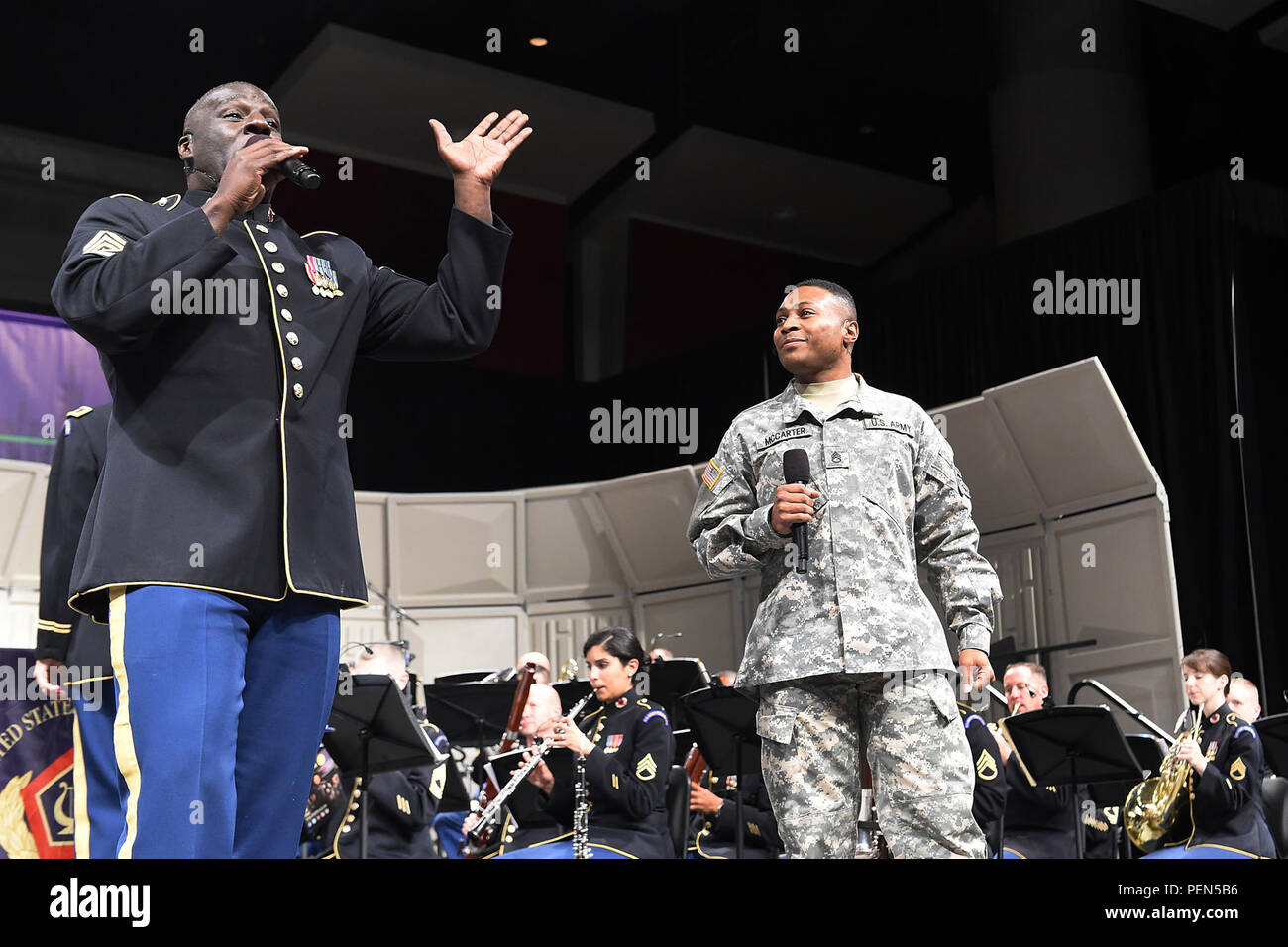 Army Sgt. Maj. Victor Cenales, left, and Staff Sgt. Keenan McCarter perform an upbeat jazz version of “Joy to the World” at the 69th Annual Midwest Clinic International Band, Orchestra and Music Conference held at the McCormick Place West in Chicago, Dec. 16. All Army band members go through basic training and then experience a rigorous audition before being hand-selected to join the U.S. Army Field Band in the Military Occupational Specialty (MOS) 42-Sierra (Army Musician). There are 60 members in the band and 29 chorus members. (U.S. Army photo by Spc. David Lietz/Released) Stock Photo