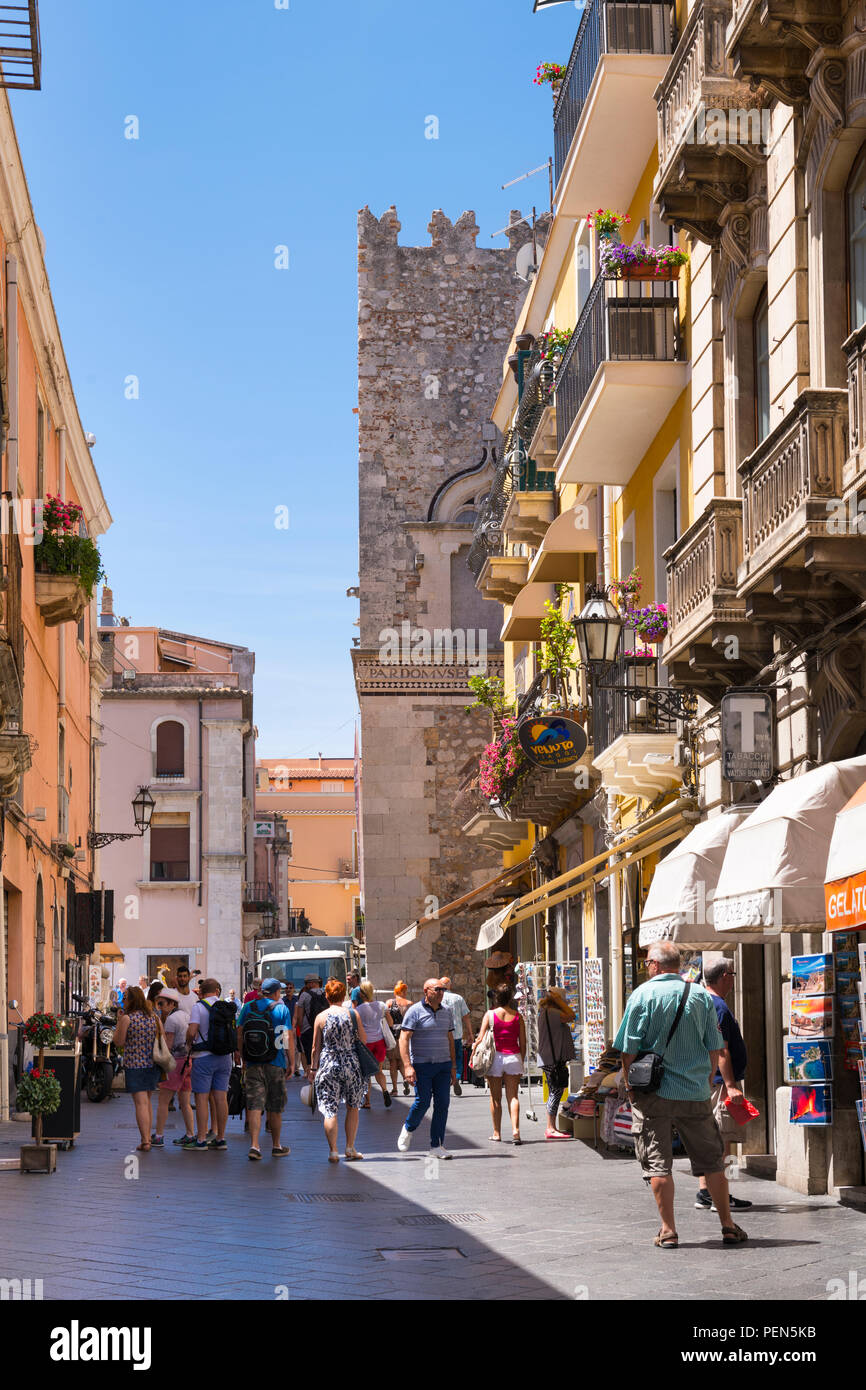 Italy Sicily Monte Tauro most famous luxury tourist resort Taormina typical pedestrian street scene Torre dell Orlogio watch tower shops stores Stock Photo