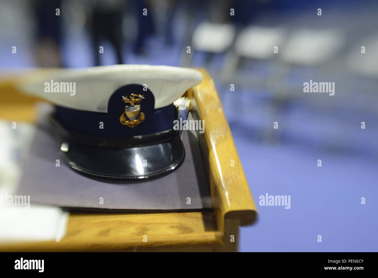 A Coast Guard combination cover adorned with the master chief rank