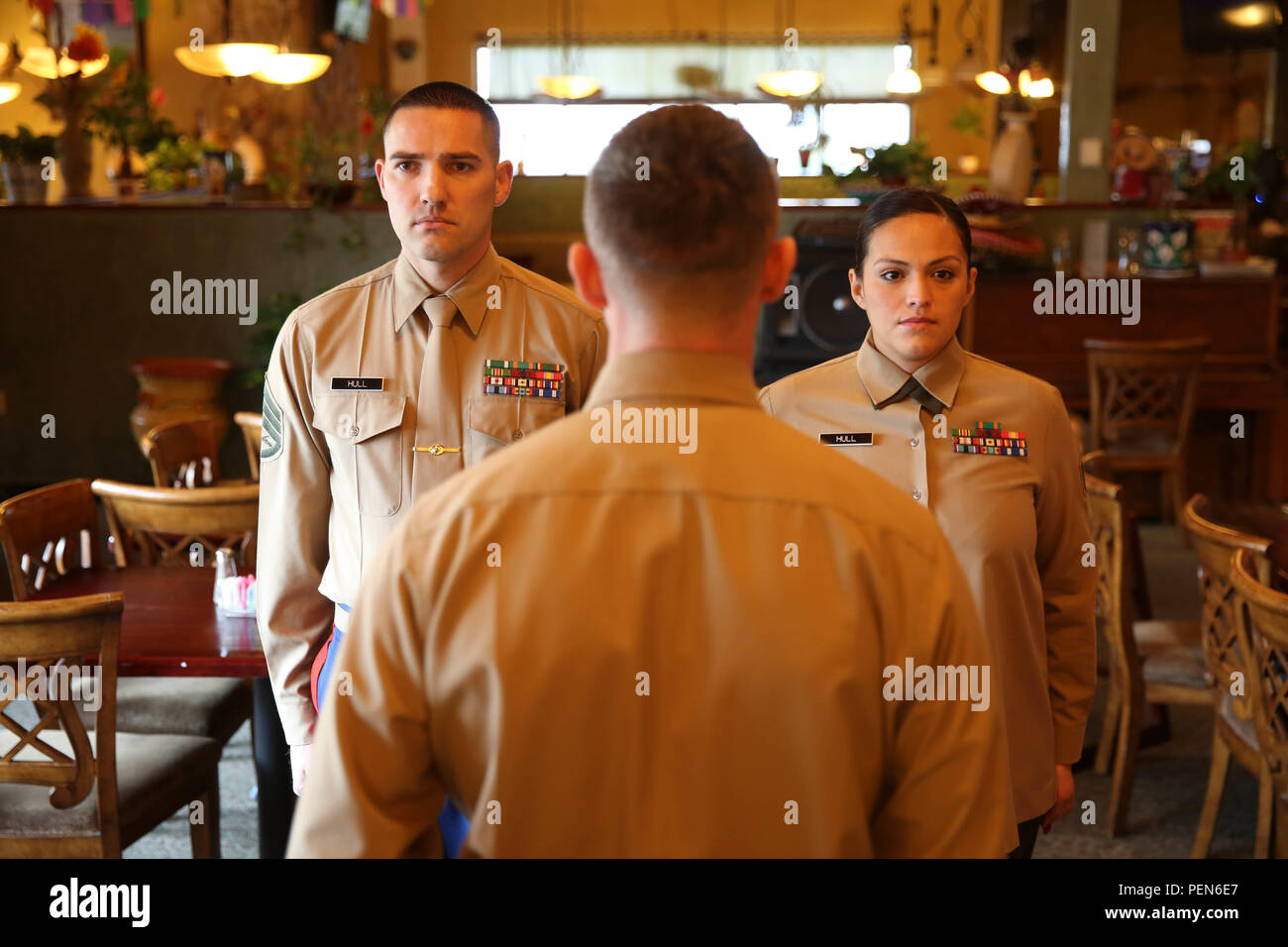 Staff Sergeants Anthony and Leslie Hull re-enlisted in the United States Marine Corps Dec. 10, 2015. This husband and wife duo has been in the Marine Corps for over a decade and plan to stay in as long as they can. The Hull's have recently successfully completed recruiting duty at Recruiting Sub Station Medford, Recruiting Station Portland, 12th Marine Corps District. The Hulls said it was a difficult assignment but their love of the Corps and the support of their family supported them every step. Anthony and Leslie both have been on combat deployments in support of Operation Iraqi Freedom and Stock Photo