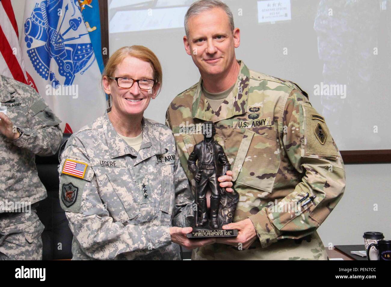 U S Army Maj Gen Scott D Berrier Commanding General U S Army Intelligence Center Of Excellence And Fort Huachuca Presents A Buffalo Soldier Statue To Lt Gen Mary A Legere Deputy Chief Of