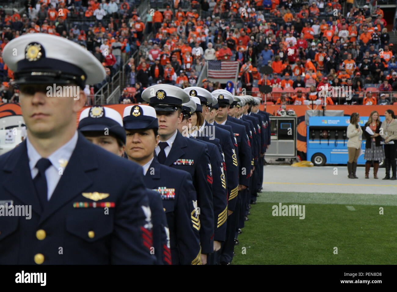 Members of the United States Coast Guard participate in half time