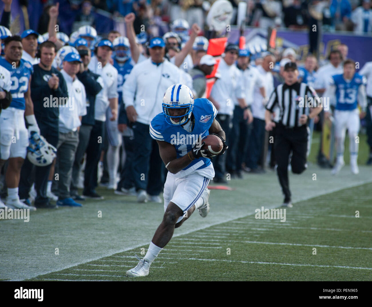 Brigham Young University wide receiver Devon Blackman tries to stay in bounds after catching a long pass during the Royal Purple Las Vegas Bowl at Sam Boyd Stadium in Las Vegas, Dec. 19, 2015. The BYU Cougars fell behind quickly in the first quarter 35-0 to the Utah Utes, rallied late in the game, but came up a touchdown short. (U.S. Air Force photo by Senior Airman Thomas Spangler) Stock Photo